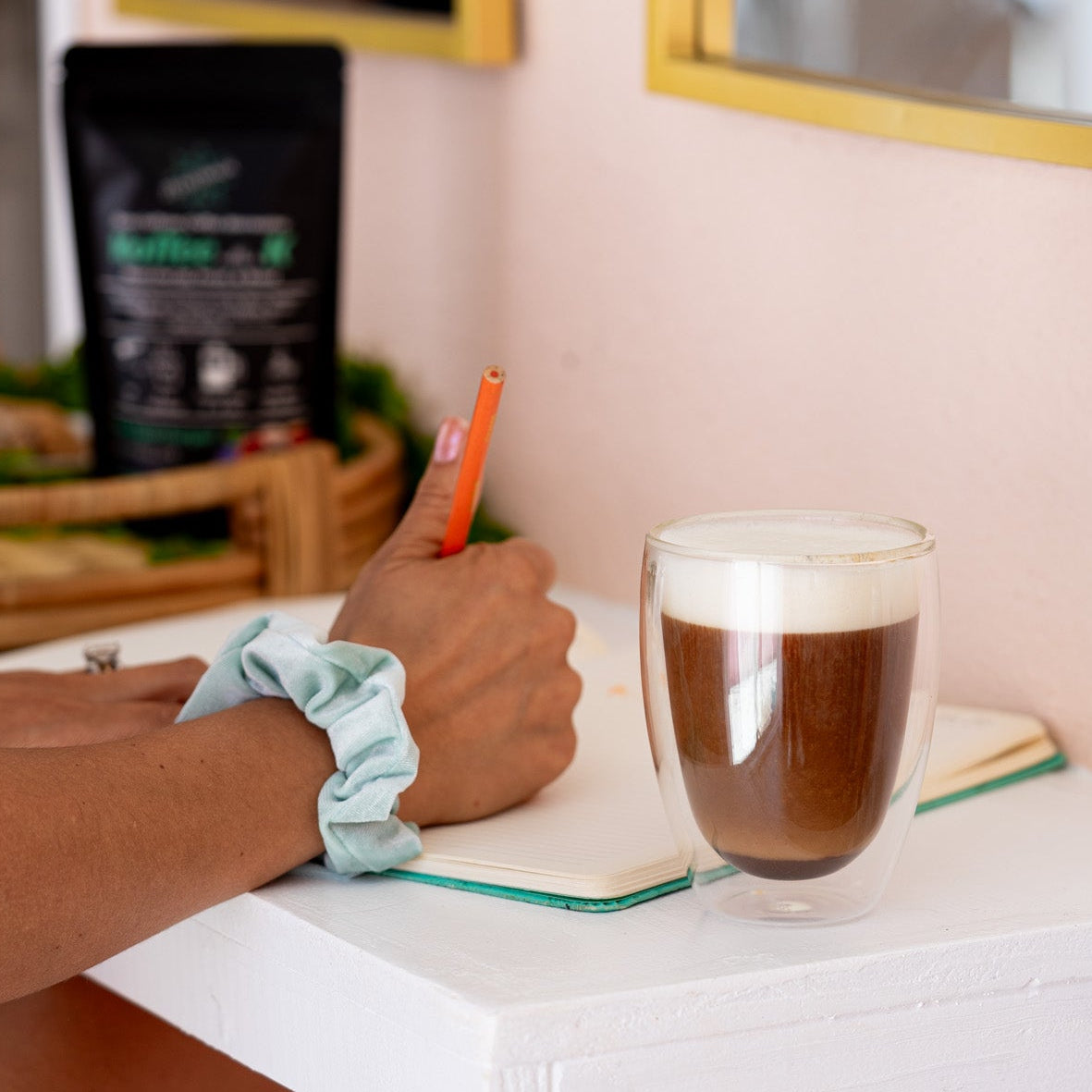 woman enjoying her caffeine-free mushroom coffee ritual from zplantmagic while starting her morning journaling