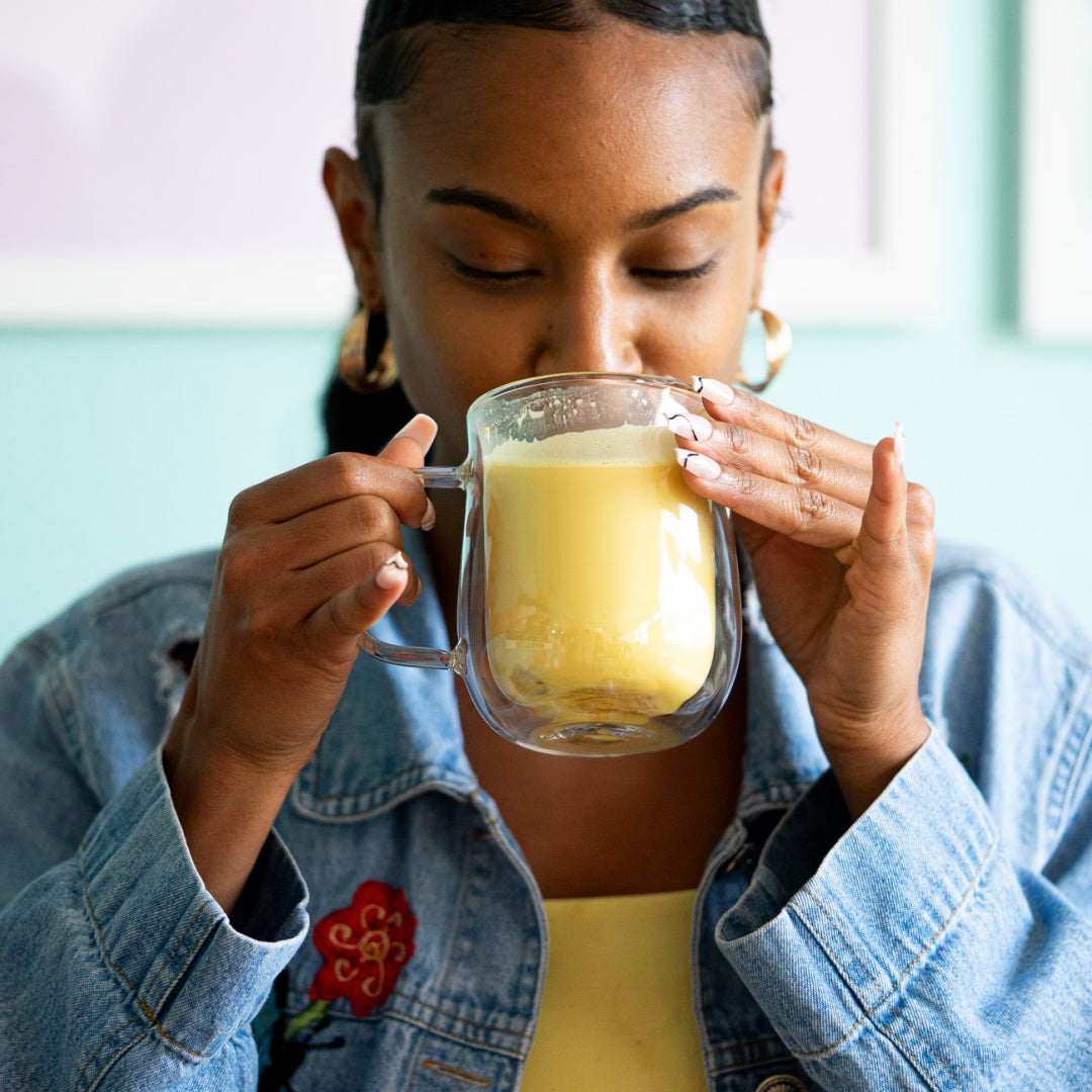 woman enjoying her lion's mane latte from zplantmagic for a morning ritual to support energy and focus