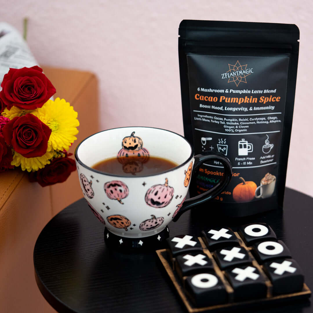 Cozy fall vibes with a warm mug of Cacao Pumpkin Spice mushroom latte beside the ZPlantMagic blend, styled for a calming, caffeine-free seasonal ritual.