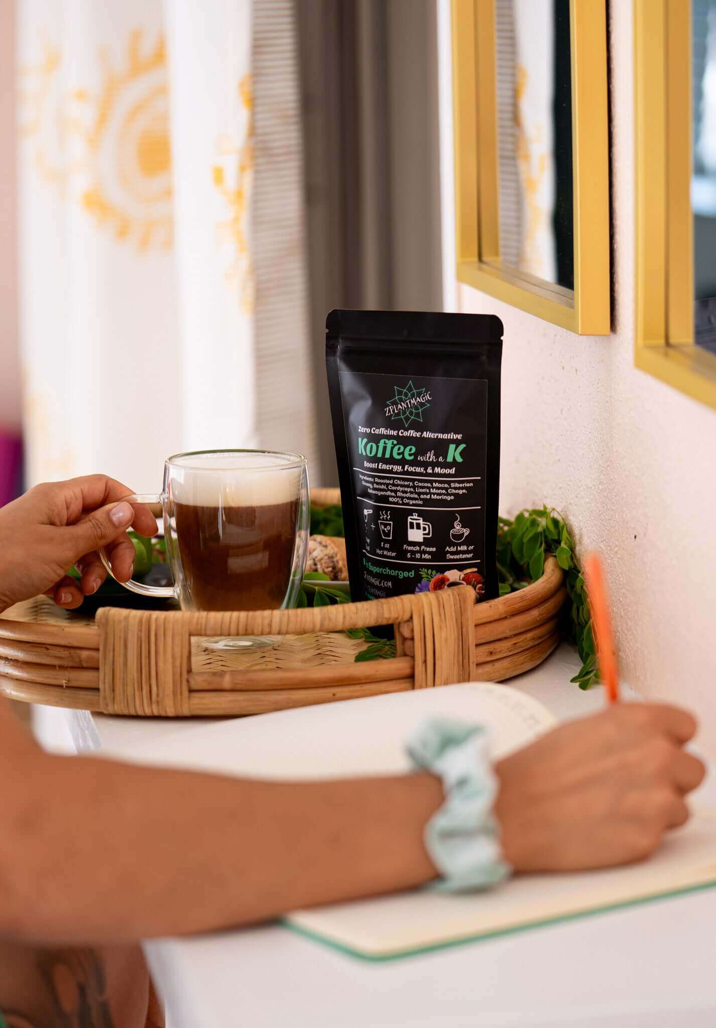 Morning ritual with Koffee with a K caffeine-free mushroom coffee served hot while journaling in natural light
