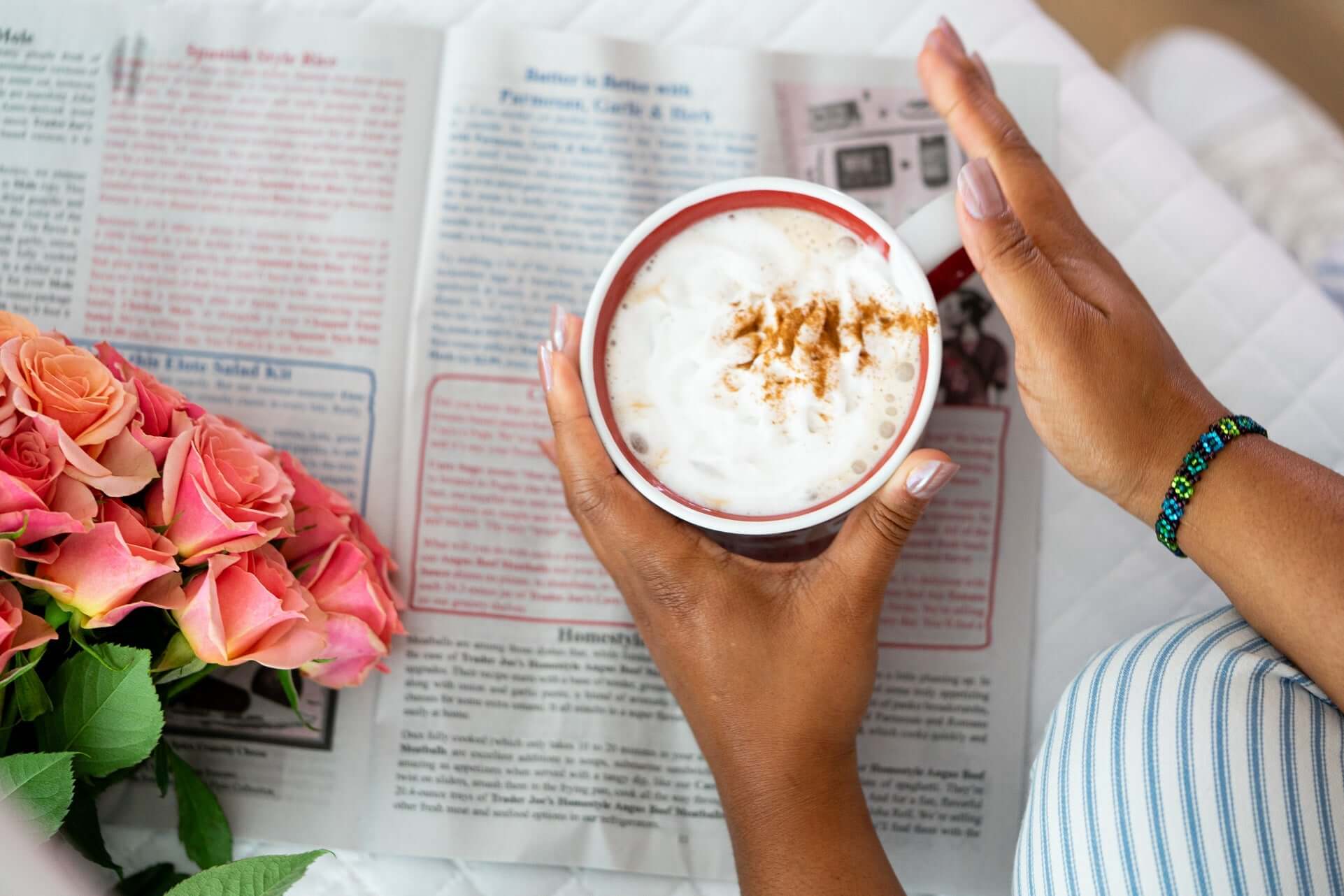 Top view of hot chocolate like mushroom latte while reading for slow morning ritual or evening wind down