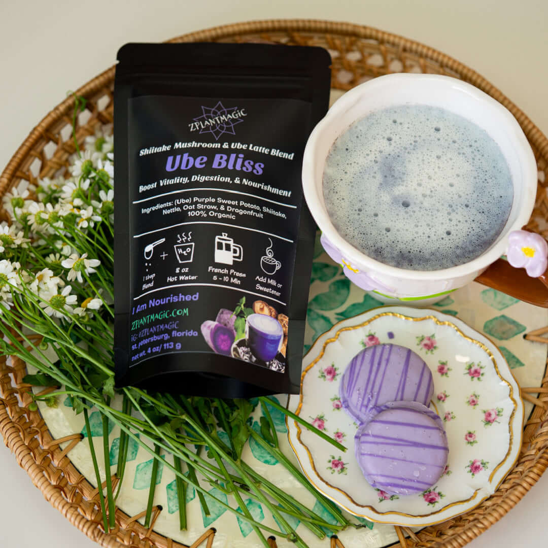 ZPlantMagic Ube Bliss mushroom latte blend displayed with a creamy purple ube latte and matching ube cookies on a decorative tray, highlighting a nourishing, cozy wellness ritual.